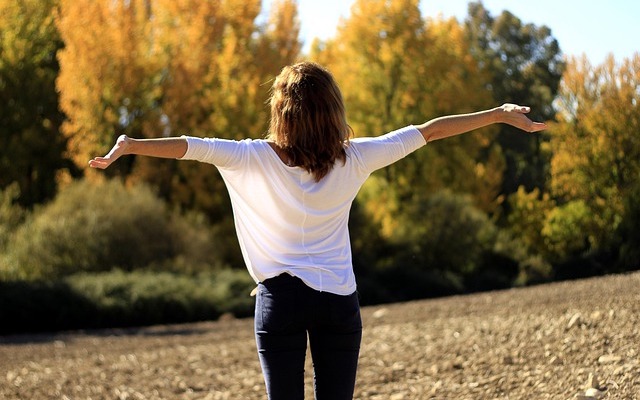 Anxious woman feeling relieved in nature